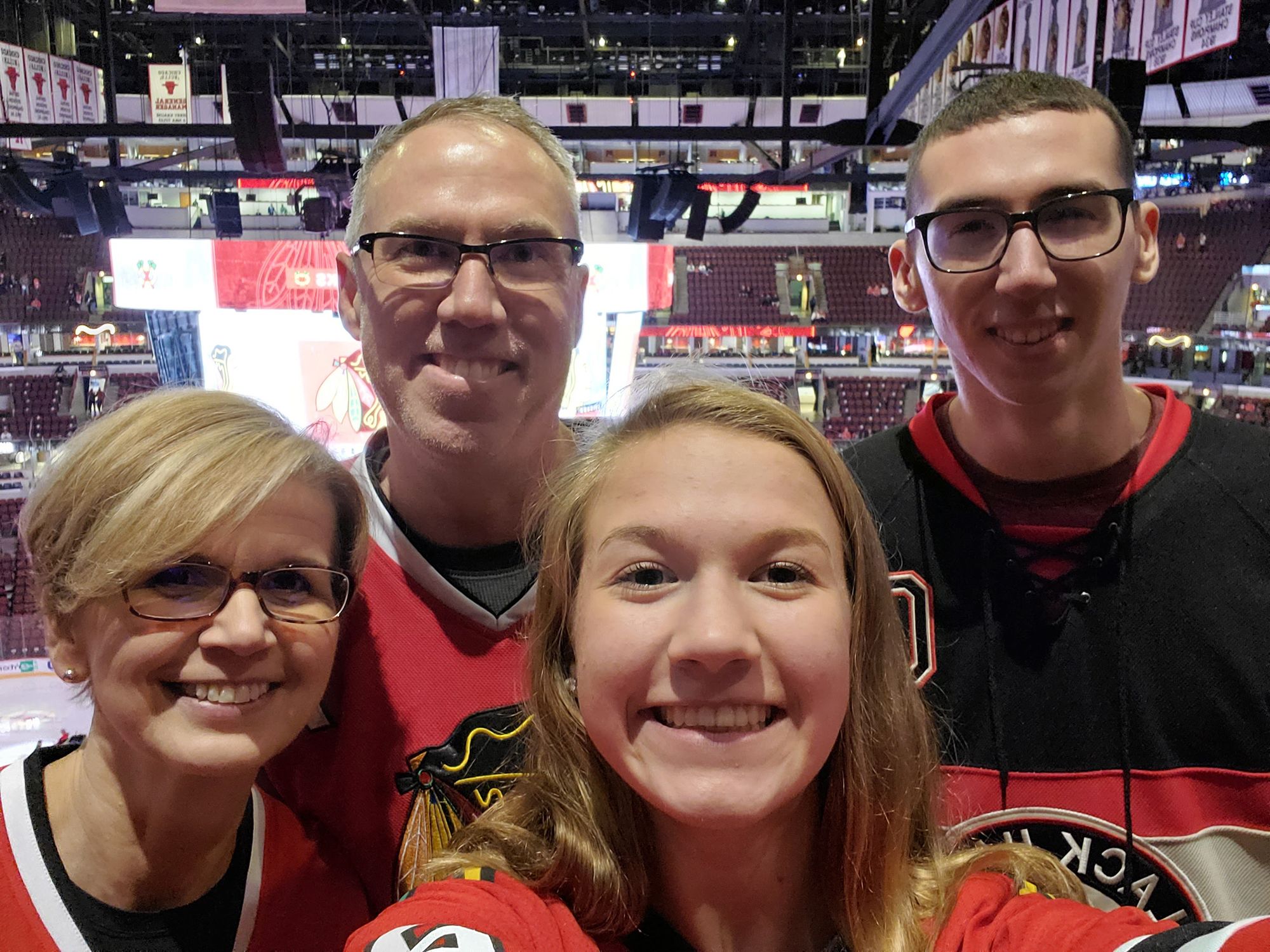 Alex and his family together at a hockey arena