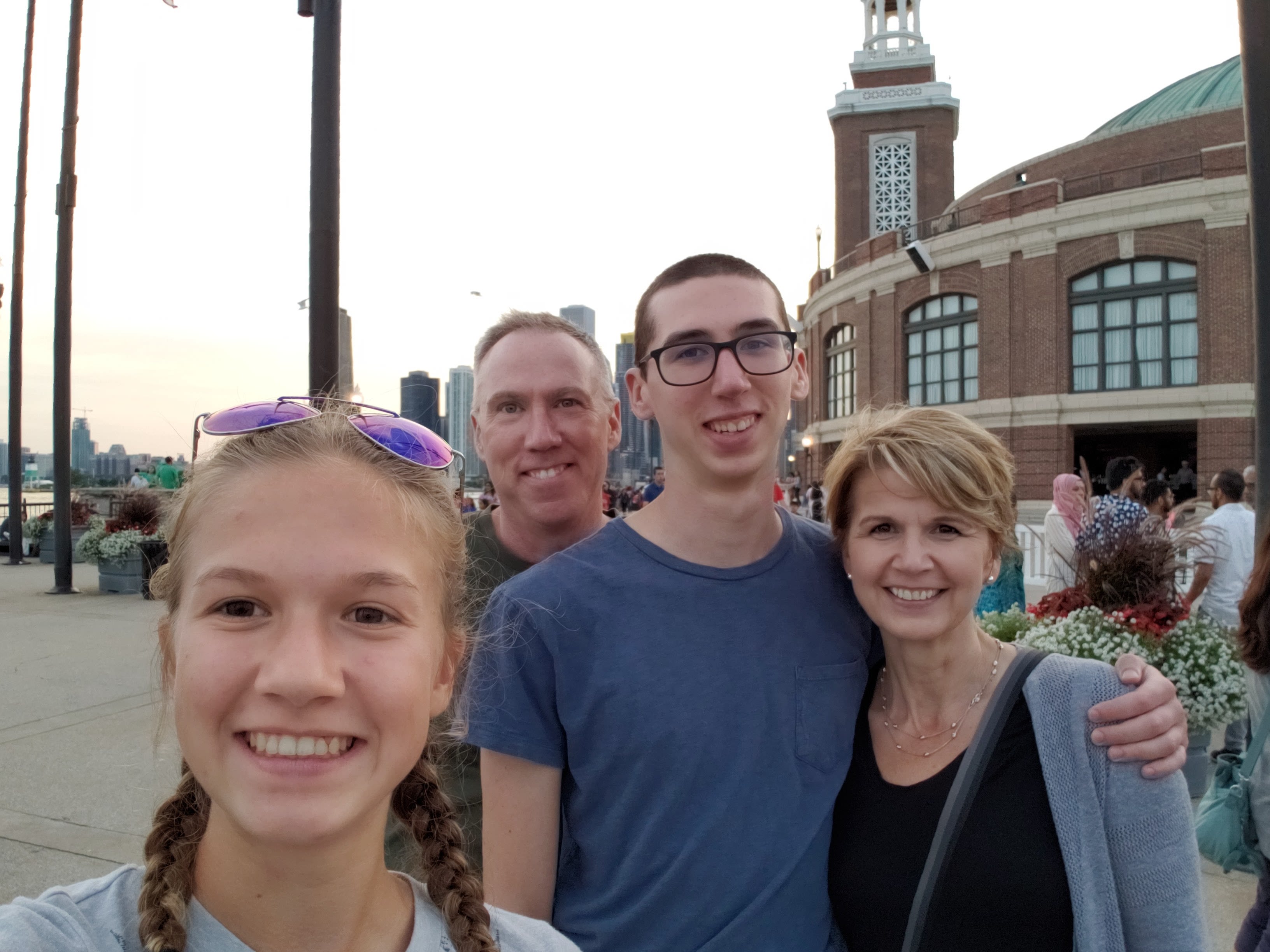 Alex and his family smiling together near the Chicago waterfront